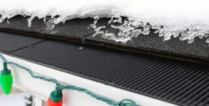 A close-up view of gutter guards protecting gutters from the snow